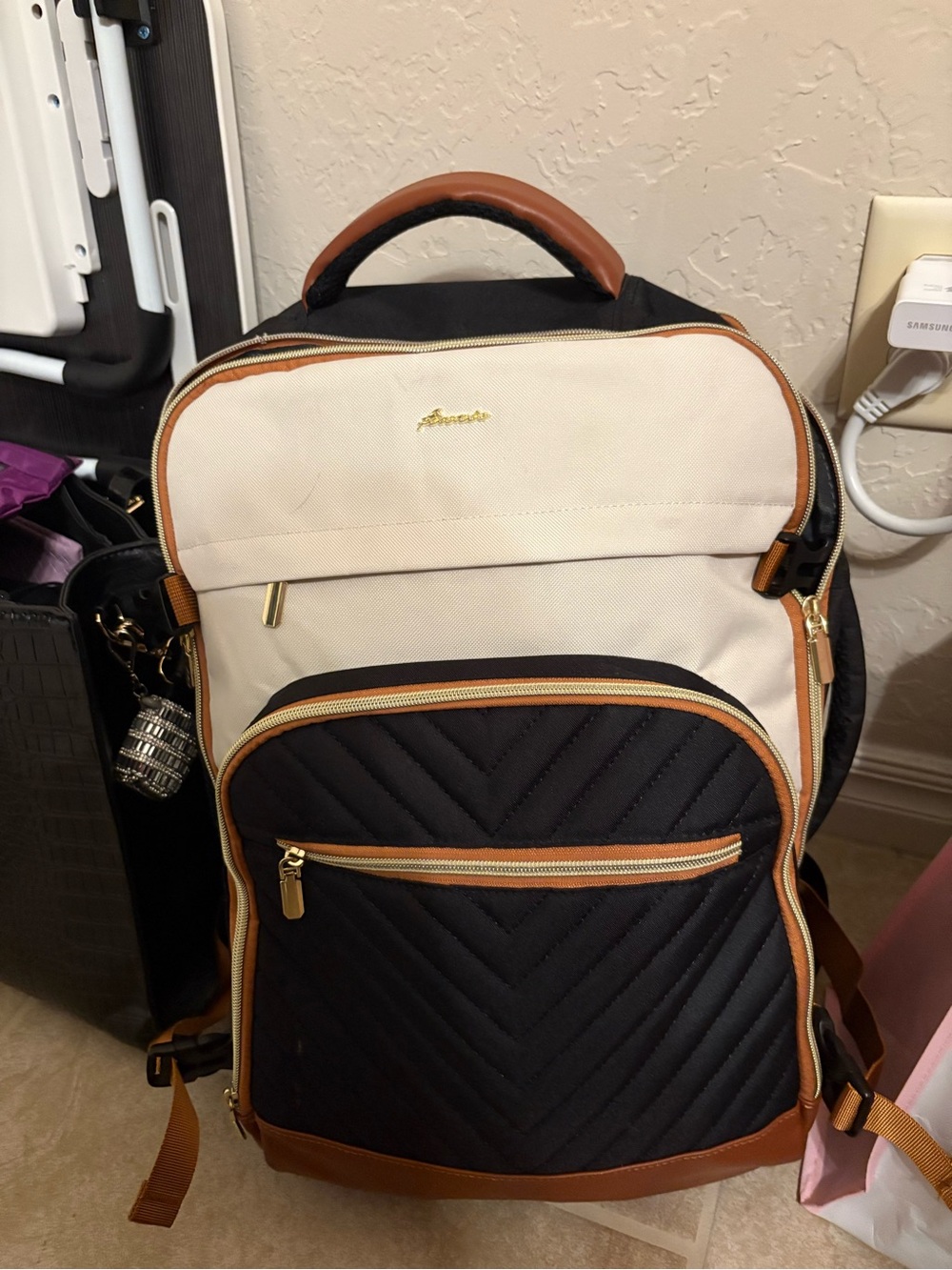Black and Cream Quilted Travel Backpack with Brown Trim